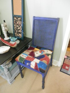After pic of cane back chair - painted two tone w/ blue and black and antiqued w/ black glaze. Has beautiful quilted look fabric. 